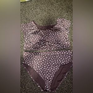 Two piece bikini. It’s like a cropped shirt kinda but swim suit material.